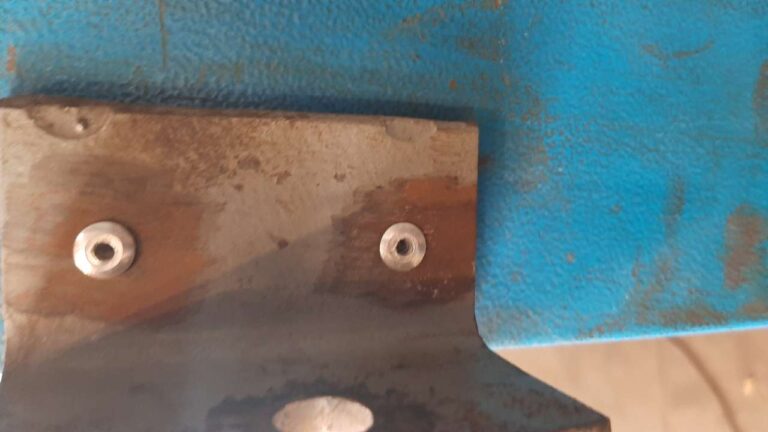 Angle iron pop riveted to metal plate